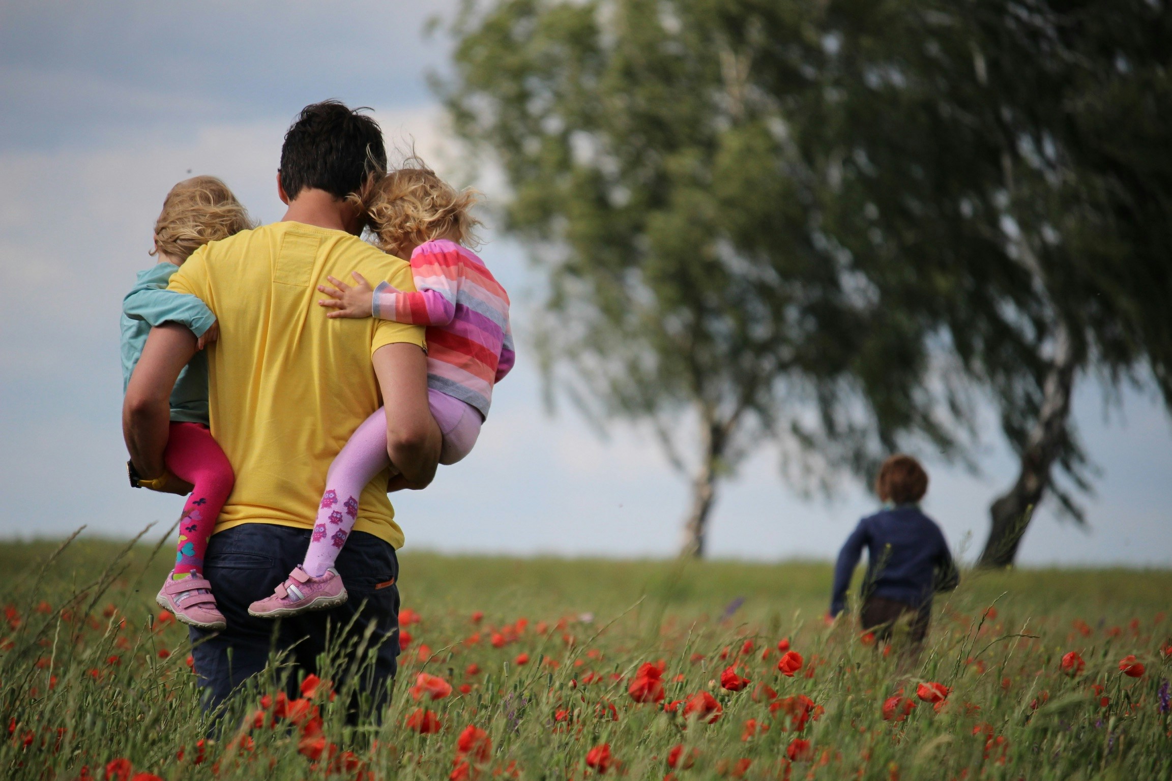 Dad and kids playing